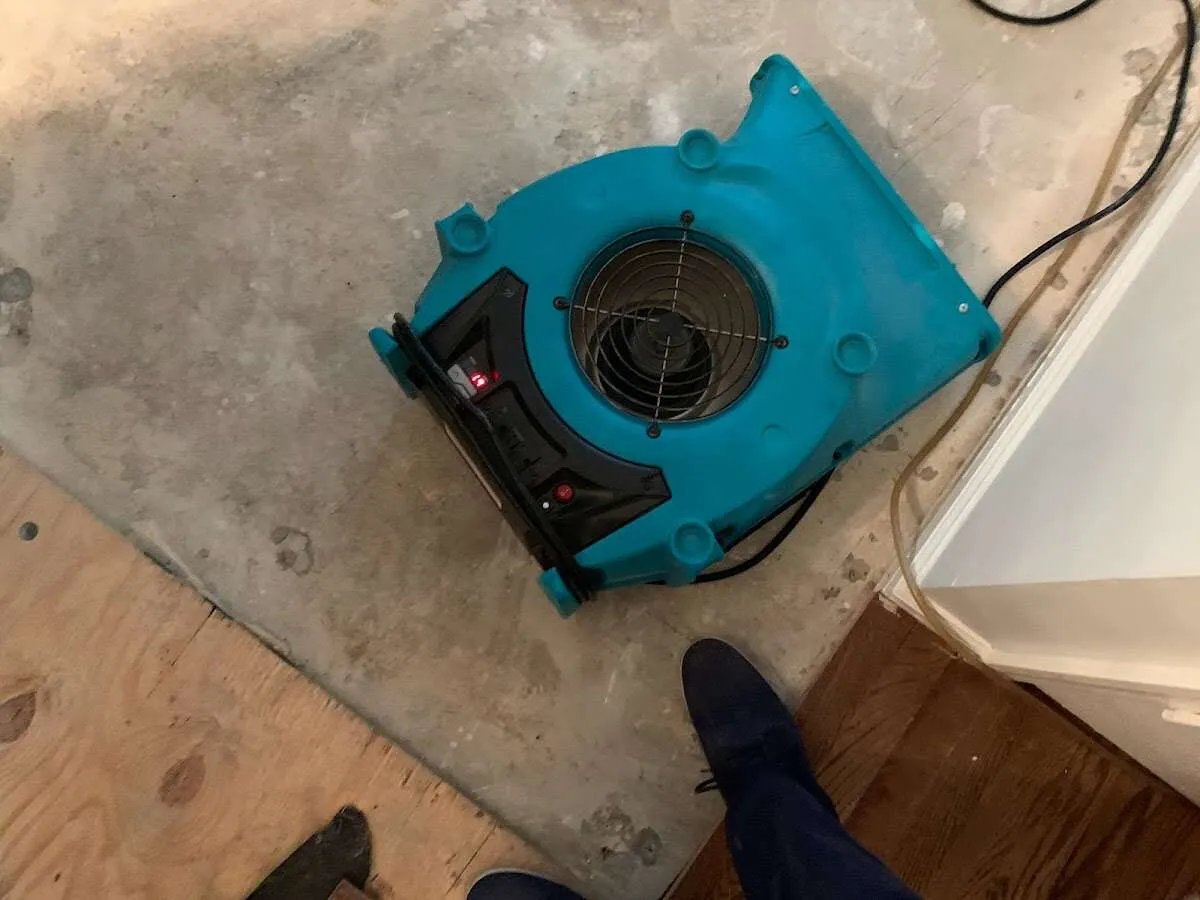 Air mover drying subfloor during Leak Detection & Repair in Oak Ridge